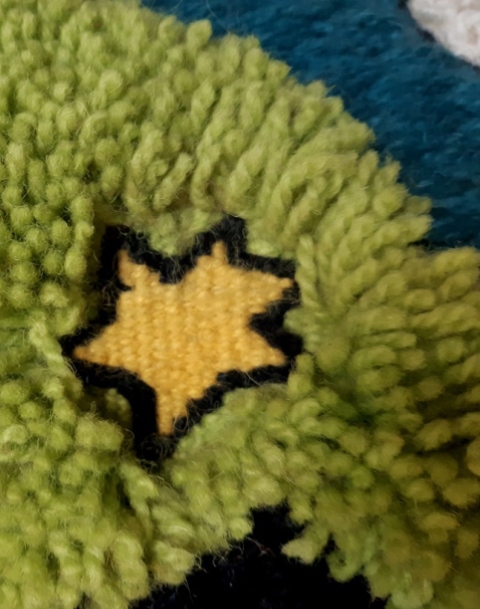 Knotted-weft-flat-tapestry-woven-star.jpg