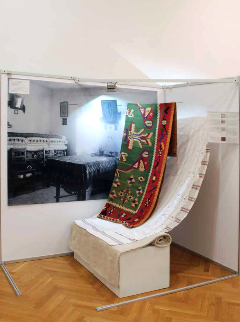 Multiethnic Vojvodina textile traditions-Bed-lyers-mattress-simple-sheet-luxury-lavish-embroidery-kilim-composition-bees-and-butterflies.jpg